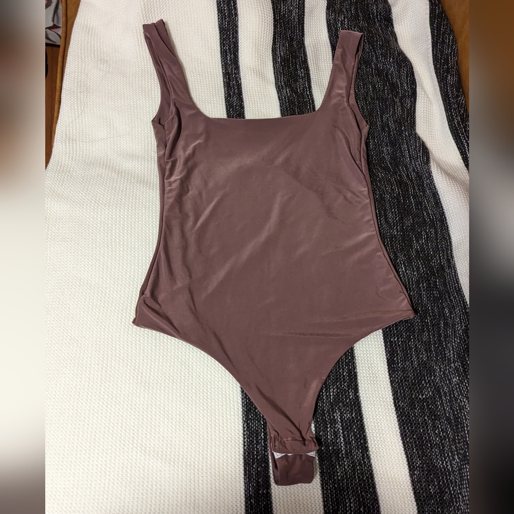 Pretty Little Things size 2 purple bodysuit